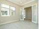 Home office with glass french doors, large window, and tile floors at 4630 Blushing Dawn Ave, Las Vegas, NV 89118