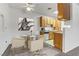 Cozy dining area with modern table and chairs, alongside a well-equipped kitchen with bright cabinets at 4730 E Craig Rd # 1093, Las Vegas, NV 89115