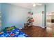 bedroom with wood floors, ceiling fan and closet at 4837 River Splash Ave, Las Vegas, NV 89131