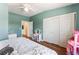 Bedroom with ceiling fan, closet, and view to the connected bathroom at 4837 River Splash Ave, Las Vegas, NV 89131