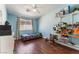 bedroom with wood floors, ceiling fan and closet at 4837 River Splash Ave, Las Vegas, NV 89131