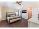 Inviting bedroom with hardwood floors, natural light, and a ceiling fan at 4837 River Splash Ave, Las Vegas, NV 89131