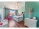bedroom with wood floors, ceiling fan and closet at 4837 River Splash Ave, Las Vegas, NV 89131