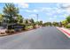 Community entrance with well-manicured landscaping and a stylish monument sign at Lynbrook at 4837 River Splash Ave, Las Vegas, NV 89131