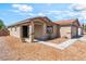 Cozy single-story home with desert-style landscaping and a covered front porch at 4837 River Splash Ave, Las Vegas, NV 89131