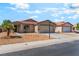 A well-maintained single-Gathering home with a two-car garage and xeriscaping at 4837 River Splash Ave, Las Vegas, NV 89131