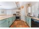Well-lit kitchen featuring stainless steel appliances, a wooden countertop, and tiled floors at 4837 River Splash Ave, Las Vegas, NV 89131