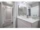 Well-lit bathroom features stylish flooring, a double mirror, and modern fixtures at 5219 Caliente St # 11, Las Vegas, NV 89119