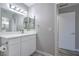 Bright bathroom features a double mirror, cabinet, and modern fixtures at 5219 Caliente St # 11, Las Vegas, NV 89119