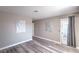 Serene bedroom featuring stylish floors, wall art and door that leads to the outside at 5219 Caliente St # 11, Las Vegas, NV 89119