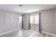 Relaxing bedroom with plenty of light featuring stylish floors, a window and a door at 5219 Caliente St # 11, Las Vegas, NV 89119