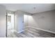 Spacious bedroom with hardwood floors leading to the laundry room, offering convenience and style at 5219 Caliente St # 11, Las Vegas, NV 89119
