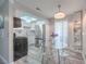 Bright dining area with modern light fixture next to renovated kitchen at 5219 Caliente St # 11, Las Vegas, NV 89119