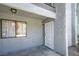 Exterior of home features a window and storm door entrance at 5219 Caliente St # 11, Las Vegas, NV 89119