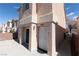Exterior view of home featuring backyard patio and access door at 5461 Dungaree St, Las Vegas, NV 89118