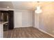 Open dining room with hardwood floors and modern chandelier, adjacent to the kitchen at 5461 Dungaree St, Las Vegas, NV 89118