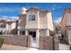 Well-maintained two-story home featuring a secure, fenced front yard space at 5461 Dungaree St, Las Vegas, NV 89118