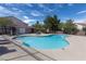 Community pool area with clear water, lounge seating, and mature landscaping at 5461 Dungaree St, Las Vegas, NV 89118