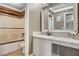 Bathroom features a shower and tub combo and a vanity with quartz countertops and elegant fixtures at 5516 Tantalum Ln, Las Vegas, NV 89122