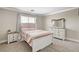 Comfortable bedroom featuring a bed, nightstand, dresser, and ample natural light from the window at 5516 Tantalum Ln, Las Vegas, NV 89122