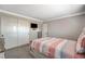 Bedroom featuring a comfortably made bed, closet, and easy access to other areas of the home at 5516 Tantalum Ln, Las Vegas, NV 89122