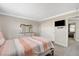 Inviting bedroom with a comfortable bed, dresser, mirror, and closet space for organized storage at 5516 Tantalum Ln, Las Vegas, NV 89122