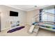 Cozy bedroom with a unique bunk bed featuring a built-in slide, perfect for a imaginative playtime at 5516 Tantalum Ln, Las Vegas, NV 89122