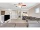 Bright bonus room features a comfortable sofa, desk area, and ample space for relaxation and entertainment at 5516 Tantalum Ln, Las Vegas, NV 89122