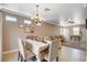Cozy dining room featuring elegant lighting and seating arrangement, perfect for Gathering meals and gatherings at 5516 Tantalum Ln, Las Vegas, NV 89122