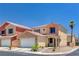 Charming two-story home with a well-maintained front yard, attached garage, and a beautiful desert landscape at 5516 Tantalum Ln, Las Vegas, NV 89122