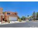 Well-maintained home with attached garage and desert landscaping on a sunny day at 5516 Tantalum Ln, Las Vegas, NV 89122