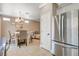 Bright kitchen featuring stainless steel refrigerator and tile flooring at 5516 Tantalum Ln, Las Vegas, NV 89122