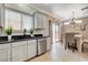 The kitchen features black countertops, a stainless steel dishwasher, and ample storage at 5516 Tantalum Ln, Las Vegas, NV 89122
