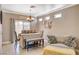 Inviting dining area with a chandelier and a comfortable seating arrangement at 5516 Tantalum Ln, Las Vegas, NV 89122