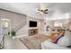 Bright and airy living area with neutral walls, tiled floors, a ceiling fan, and an open floor plan at 5516 Tantalum Ln, Las Vegas, NV 89122