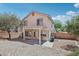 Backyard showcasing a covered patio, landscaping and block wall at 575 Aspen Leaf St, Las Vegas, NV 89144