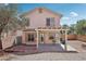 Picture of the backyard with a covered patio, landscaping and block wall at 575 Aspen Leaf St, Las Vegas, NV 89144