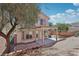 Backyard view featuring a covered patio, landscaping and block wall at 575 Aspen Leaf St, Las Vegas, NV 89144