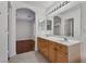 Bright bathroom featuring a double sink vanity and tile flooring at 575 Aspen Leaf St, Las Vegas, NV 89144