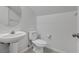 Cozy bathroom with a pedestal sink and toilet at 575 Aspen Leaf St, Las Vegas, NV 89144