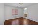 Bedroom with natural light, laminate flooring, and an ensuite bathroom at 575 Aspen Leaf St, Las Vegas, NV 89144