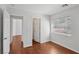 Bedroom with wood floors and large window overlooking the backyard at 575 Aspen Leaf St, Las Vegas, NV 89144