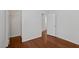 Bedroom with wood floors, open closet, and neutral paint at 575 Aspen Leaf St, Las Vegas, NV 89144