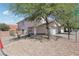 Charming two-story home featuring a low maintenance rock yard and mature desert landscaping in a suburban neighborhood at 575 Aspen Leaf St, Las Vegas, NV 89144