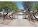 A well-maintained single-Gathering home with a two-car garage and low-maintenance landscaping at 575 Aspen Leaf St, Las Vegas, NV 89144