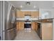 Bright kitchen features granite countertops and stainless steel appliances at 575 Aspen Leaf St, Las Vegas, NV 89144
