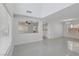 Open living room with vaulted ceiling, large windows, and neutral decor at 575 Aspen Leaf St, Las Vegas, NV 89144
