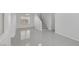 Spacious living room area featuring tile flooring and access to the staircase at 575 Aspen Leaf St, Las Vegas, NV 89144