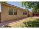 Secluded backyard featuring a covered patio and easy to maintain landscape at 5896 Shining Moon Ct, Las Vegas, NV 89131