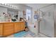 Well-lit bathroom with a soaking tub, shower and tiled floors at 5896 Shining Moon Ct, Las Vegas, NV 89131